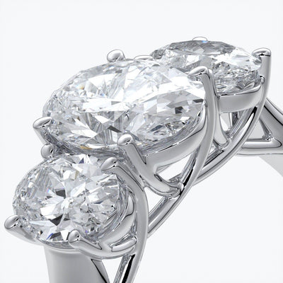Lucida Engagement ring oval trilogy 4 claw cathedral 18ct white gold