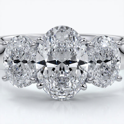 Lucida Engagement ring oval trilogy 4 claw cathedral 18ct white gold