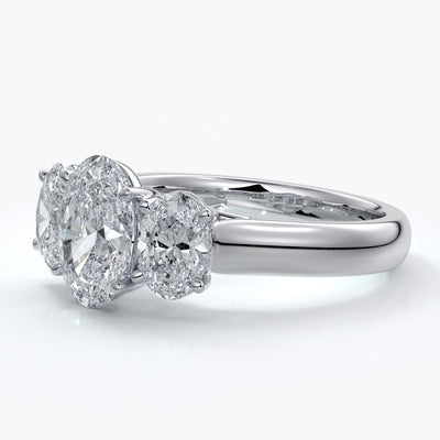 Lucida Engagement ring oval trilogy 4 claw cathedral 18ct white gold