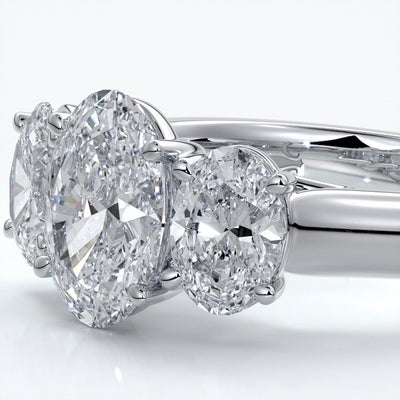 Lucida Engagement ring oval trilogy 4 claw cathedral 18ct white gold